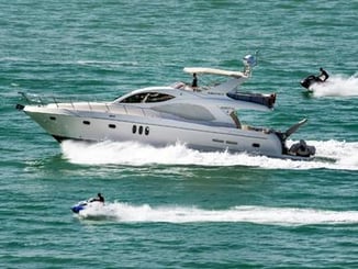 Large Vessel Leading armada of small boats